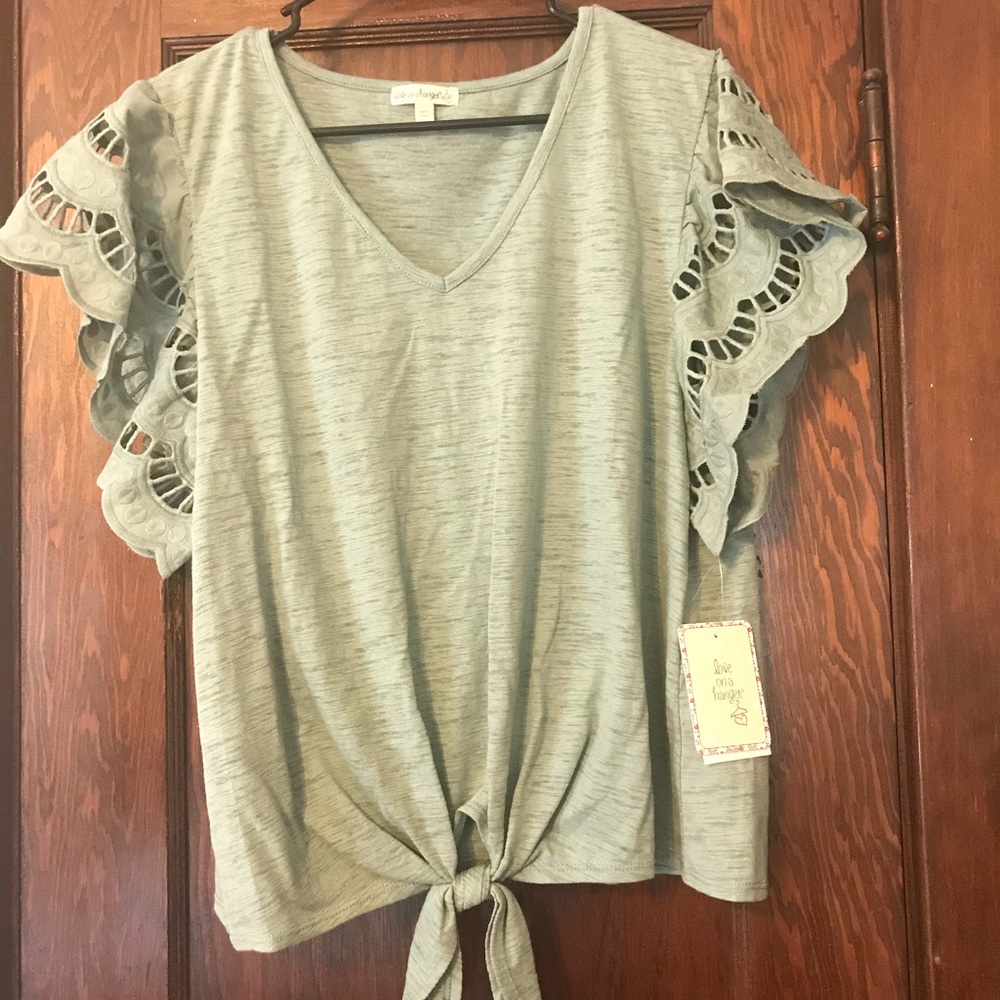 Light green blouse with cutout shoulders